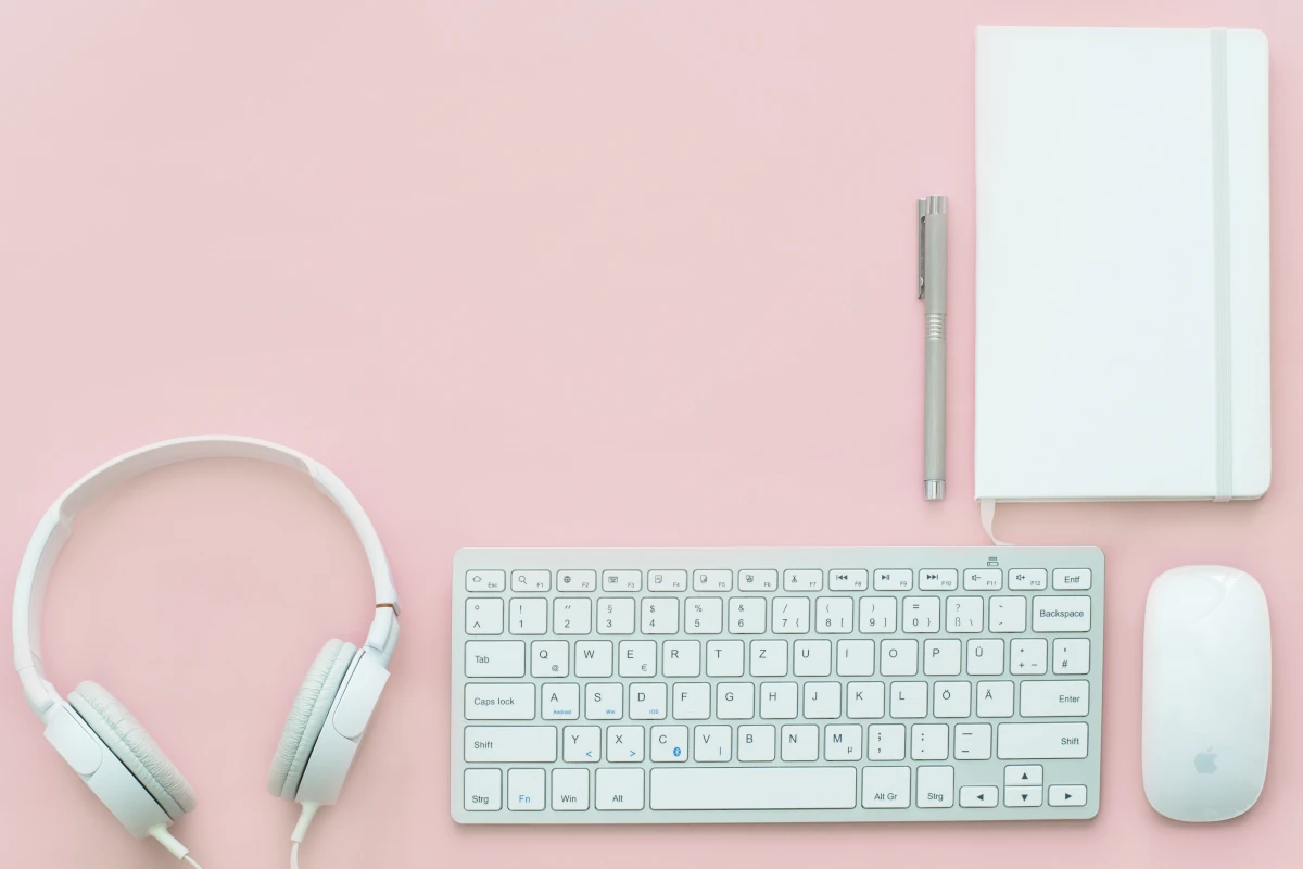 Pink background with apple devices in front
