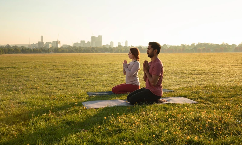 People Meditating in a field Pakistan